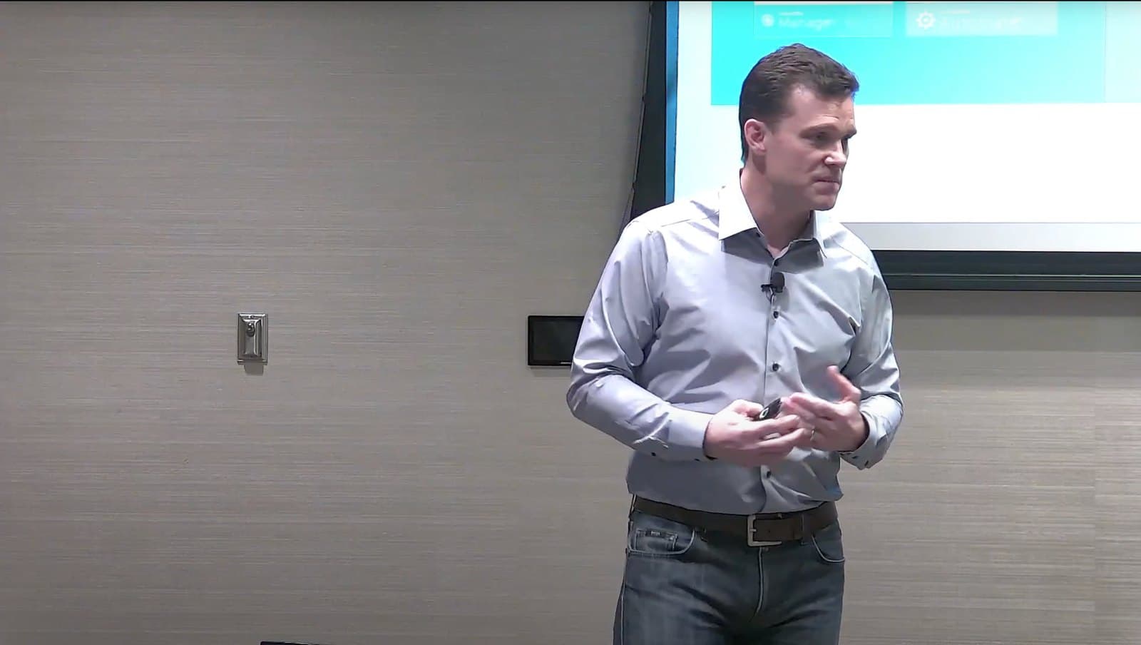 Russ Reeder presenting on stage